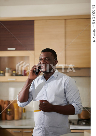 Man Talking on Phone with Friend Man Talking on Phone with Friend 93173041