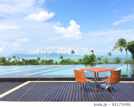 Beautiful landscape of sea ocean with outdoor swimming pool on white cloud blue sky background for leisure travel and vacation. Beautiful landscape of sea ocean with outdoor swimming pool on white cloud blue sky background for leisure travel and vacation. 93173496