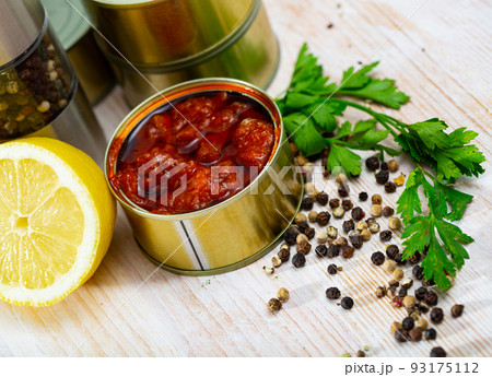 Image of pickled squids in American Salsa sauce in open tin can Image of pickled squids in American Salsa sauce in open tin can 93175112