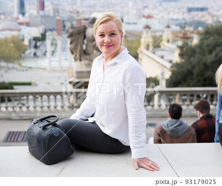 Happy confident senior woman smiling outdoors 93179025