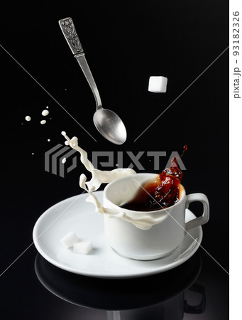 Coffee with milk splashing. Coffee with milk splashing. 93182326