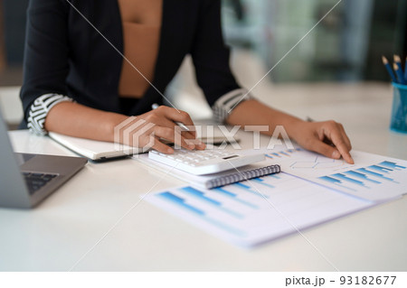 Accountant calculate financial report, computer with graph chart. Business, Finance and Accounting concept 93182677