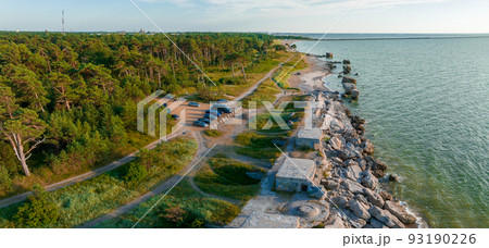 Ruins of bunkers on the beach of the Baltic sea, part of an old fort in the former Soviet base Karosta in Liepaja, Latvia. Sunset landscape. 93190226
