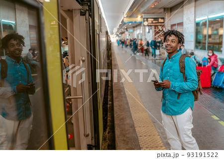 Guy looking at open door of train car 93191522