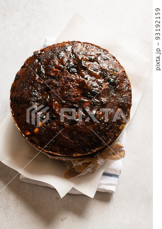 Christmas cake or chocolate pudding with fruits and nuts. Top view. Christmas cake or chocolate pudding with fruits and nuts. Top view. 93192159