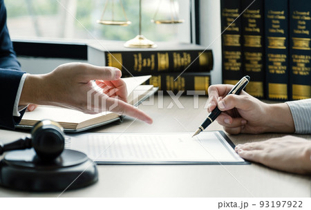 Businessman hand sign after Lawyer providing legal consult dispute service at the office with justice scale and gavel hammer Businessman hand sign after Lawyer providing legal consult dispute service at the office with justice scale and gavel hammer 93197922