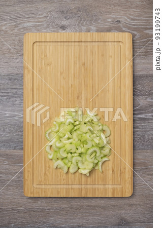 Stems of fresh juicy celery are sliced 93199743