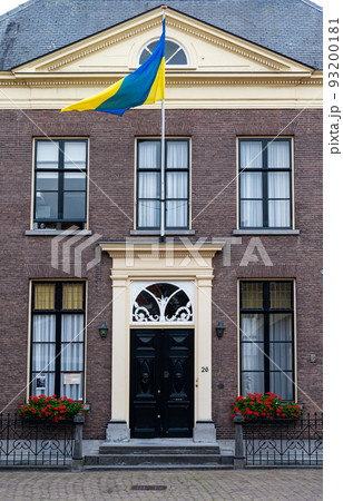 Zaltbommel, Gelderland, The Netherlands - Classical style facade with an ukrainian flag 93200181