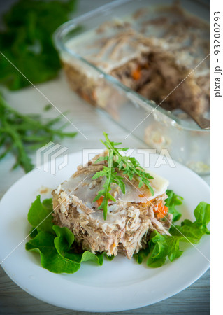 jellied meat with greens and vegetables in a plate jellied meat with greens and vegetables in a plate 93200293