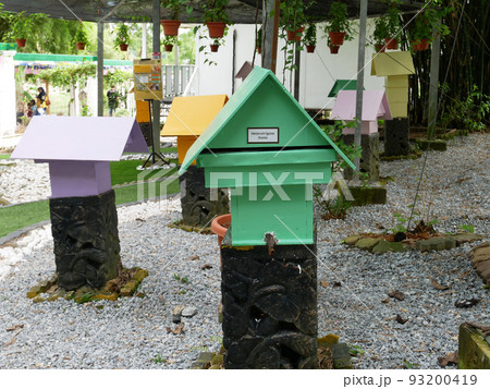 SERDANG, MALAYSIA -JUNE 7, 2022: Heterotrigona Itama or known as Stingless Bee. Man-made nests made of wood and colored colorfully to look attractive. it is farmed to get its honey. 93200419