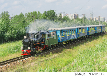 Passenger steam train of Children's railway moves to the station. Saint Petersburg, 93204615