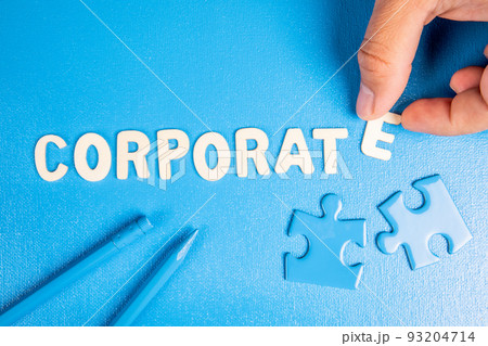 Corporate. Text from white wooden letters on a blue background 93204714