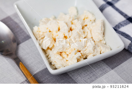 Fresh cow milk cottage cheese on plate ready to eat 93211624