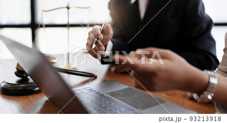 Business woman and lawyers discussing real estate agreement contract. Business woman and lawyers discussing real estate agreement contract. 93213918