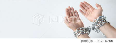 Man hands are tied with chain on white background 93216760