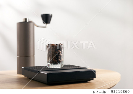 Coffee beans on a digital scale 93219860