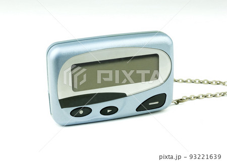 Close-up front old a cyan metallic pager or beeper on white floor and isolated with clipping path on white background. Close-up front old a cyan metallic pager or beeper on white floor and isolated with clipping path on white background. 93221639