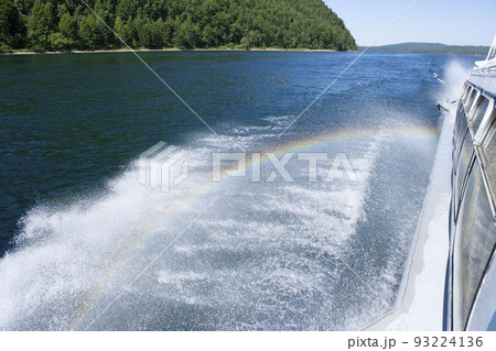 rainbow on the water from the spray boats 93224136