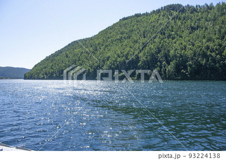 Summer travel View from a boat on the water Lake Baikal on a motor ship on the route Irkutsk Listvyanka village Big Cats Summer travel View from a boat on the water Lake Baikal on a motor ship on the route Irkutsk Listvyanka village Big Cats 93224138