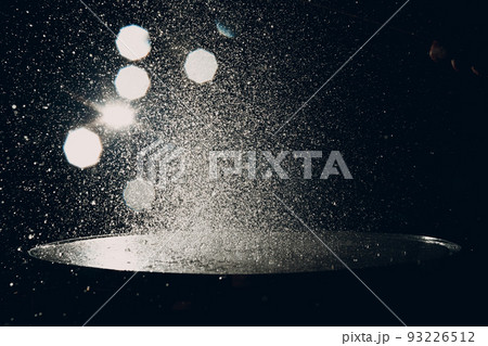 Close up drum sticks drumming hit beat rhythm on drum surface with splash water drops Close up drum sticks drumming hit beat rhythm on drum surface with splash water drops 93226512