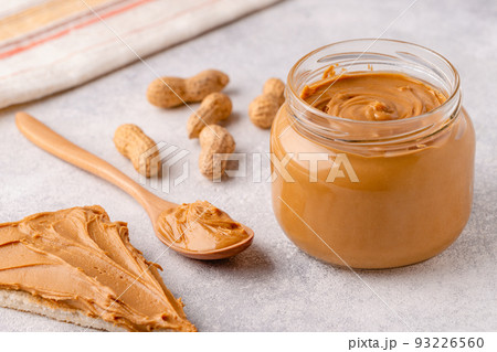 Peanut paste in an open jar Peanut paste in an open jar 93226560