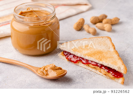 Peanut paste in an open jar 93226562