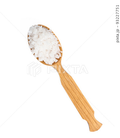 Large crystals of white sea salt in a brown wooden spoon Large crystals of white sea salt in a brown wooden spoon 93227751