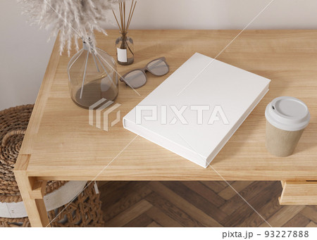 White book cover mock up with coffee cup, vase and other home accessories on wooden table. Blank template for your design. Top view, close-up. Book, catalogue cover presentation. 3D rendering. White book cover mock up with coffee cup, vase and other home accessories on wooden table. Blank template for your design. Top view, close-up. Book, catalogue cover presentation. 3D rendering. 93227888