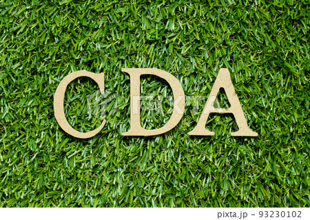 Wood alphabet letter in word CDA (Abbreviation of Confidential disclosure agreement) on green grass background Wood alphabet letter in word CDA (Abbreviation of Confidential disclosure agreement) on green grass background 93230102
