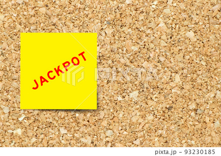 Yellow note paper with word jackpot on cork board background with copy space Yellow note paper with word jackpot on cork board background with copy space 93230185