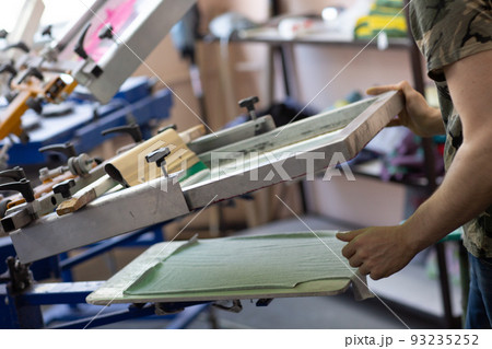 Prepare for printing and apply cloth Serigraphy silk screen print process at clothes factory Prepare for printing and apply cloth Serigraphy silk screen print process at clothes factory 93235252