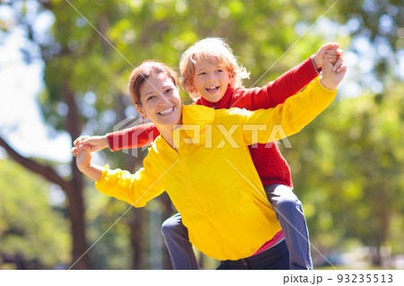 Family walking in autumn park. Fall fun. Family walking in autumn park. Fall fun. 93235513