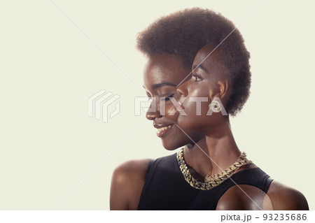 Multiple exposure portrait of black african american woman with positive smile and serious sad facial expression. Mental health, depression and emotions concept. Multiple exposure portrait of black african american woman with positive smile and serious sad facial expression. Mental health, depression and emotions concept. 93235686