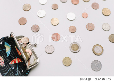 Open wallet with different coins isolated on white background top view Open wallet with different coins isolated on white background top view 93236175
