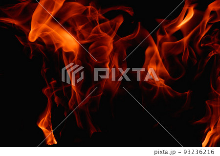 Abstract fire flame in fireplace, texture for background. Beautiful bright orange flames flicker in the darkness of the night. Abstract fire flame in fireplace, texture for background. Beautiful bright orange flames flicker in the darkness of the night. 93236216