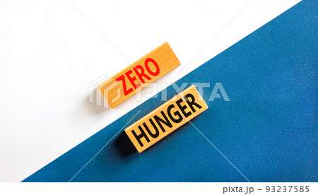 Zero hunger symbol. Concept words Zero hunger on wooden blocks on a beautiful white and blue background. Business, support and Zero hunger concept. Copy space. Zero hunger symbol. Concept words Zero hunger on wooden blocks on a beautiful white and blue background. Business, support and Zero hunger concept. Copy space. 93237585