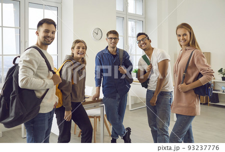 Portrait of diverse student pose with backpacks in classroom Portrait of diverse student pose with backpacks in classroom 93237776