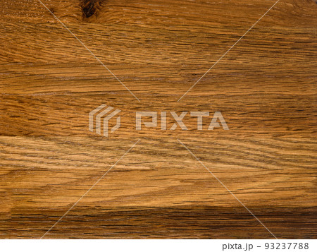 Brown Beige Texture of stained oak wood with grain, fragment of a wooden panel hardwood. surface bark is used as natural background, web page, board, table. Contrasts and symmetries. Space for text. 93237788