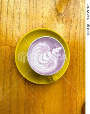 beautiful cup of Taiwanese taro milk drink with latte art in the wooden space background 93239767