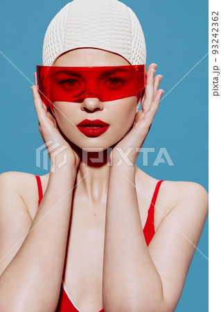 Elegant lady in red glasses swimsuit swimming cap. New generation Art fashion 93242362