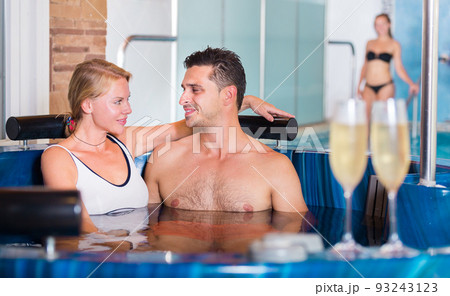 Couple is drinking champagne in spa 93243123