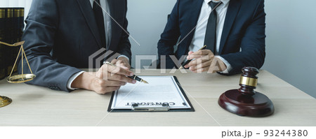 Lawyer hand holding pen and providing legal consult business dispute to the man 93244380