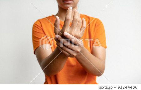 Woman hand massage physiotherapy other side is sore and numb, exhausted, tingling. Guillain-Barre Syndrome, a side effect of the Covid-19 vaccination 93244406