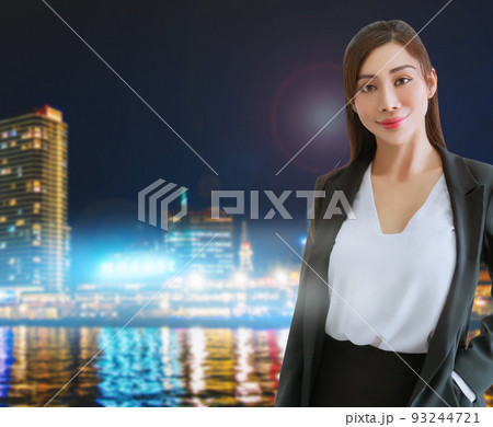 Portrait of an Asian Business woman with Japanese Kobe Modern city with bright light building background. Portrait of an Asian Business woman with Japanese Kobe Modern city with bright light building background. 93244721