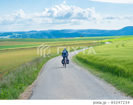 Black forest, Germany - May 29th 2022: A cyclist in the open landscape of Schwarzwald. 93247234