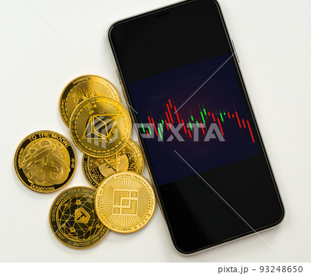 Red graph Cryptocurrency on mobile phone application with golden coin isolated on white. Red graph Cryptocurrency on mobile phone application with golden coin isolated on white. 93248650