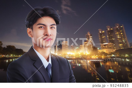Confidence businessman portrait with Modern night light City Background. Confidence businessman portrait with Modern night light City Background. 93248835