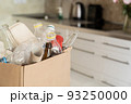 Recycling concept - box of recycling materials in kitchen background 93250000