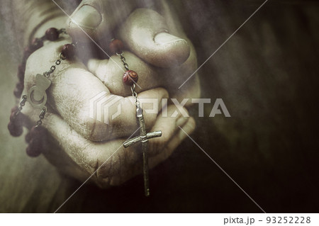 Old wrinkled woman hands holding a rosary. Closeup of christian woman hands holding rosary while praying God. Old wrinkled woman hands holding a rosary. Closeup of christian woman hands holding rosary while praying God. 93252228