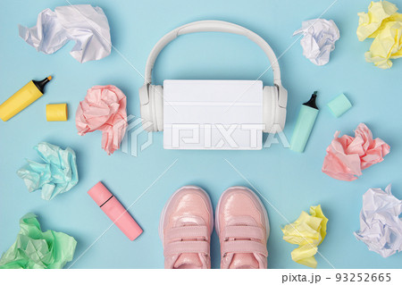 Blank lightbox. Headphones, pink shoes, colored crumpled paper balls, marker on blue background. Education concept. Flat Lay Top view Still life Mock up Template Blank lightbox. Headphones, pink shoes, colored crumpled paper balls, marker on blue background. Education concept. Flat Lay Top view Still life Mock up Template 93252665